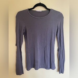 A grey long sleeve w a slit on the elbows for character